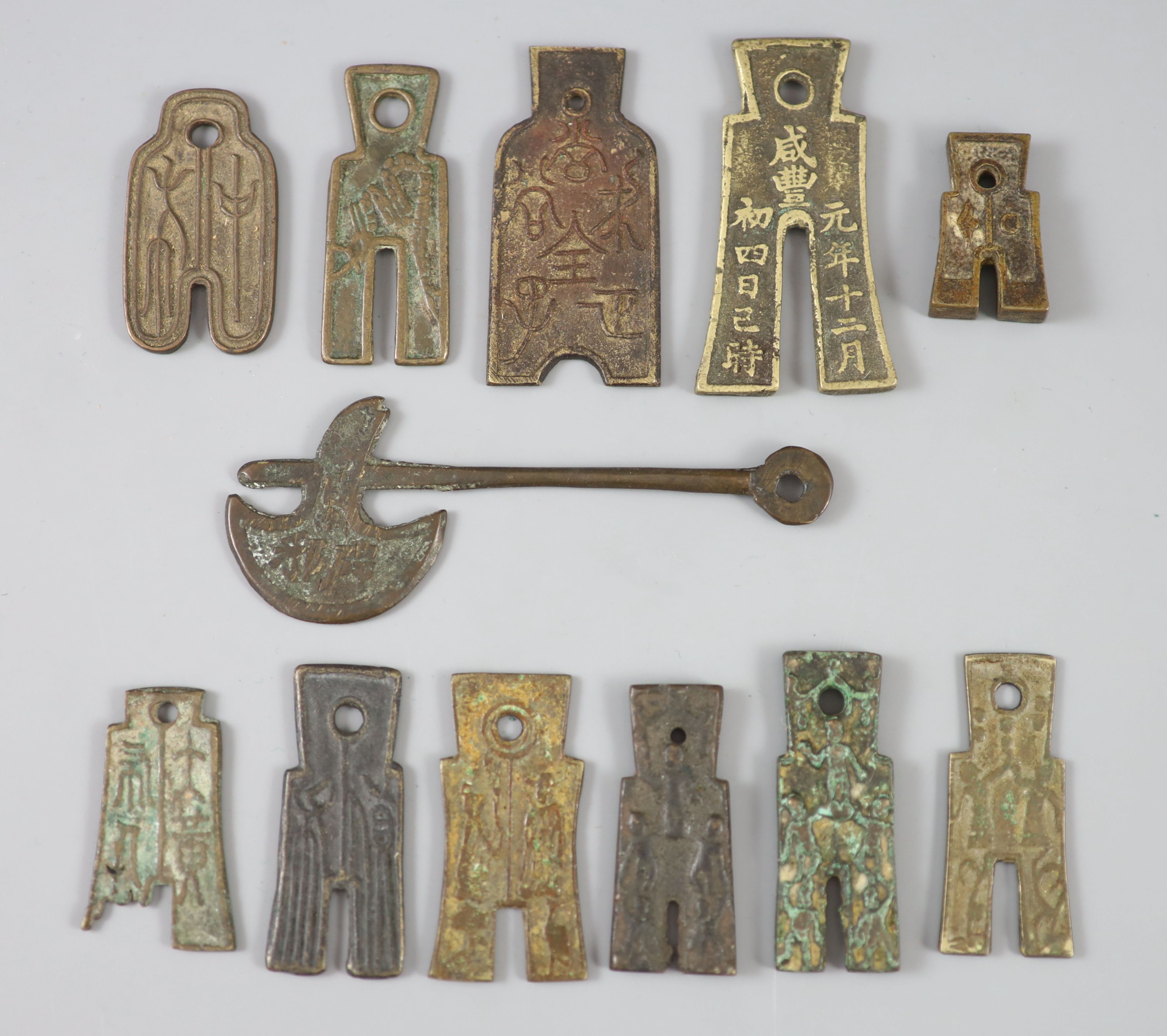 China, 11 bronze spade shaped charms or amulets, Qing dynasty,